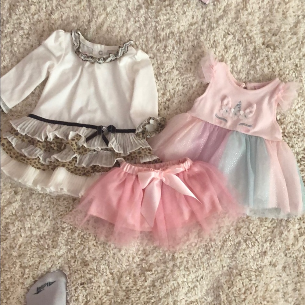 2 dresses and one tutu 6-9 months - 2 are new